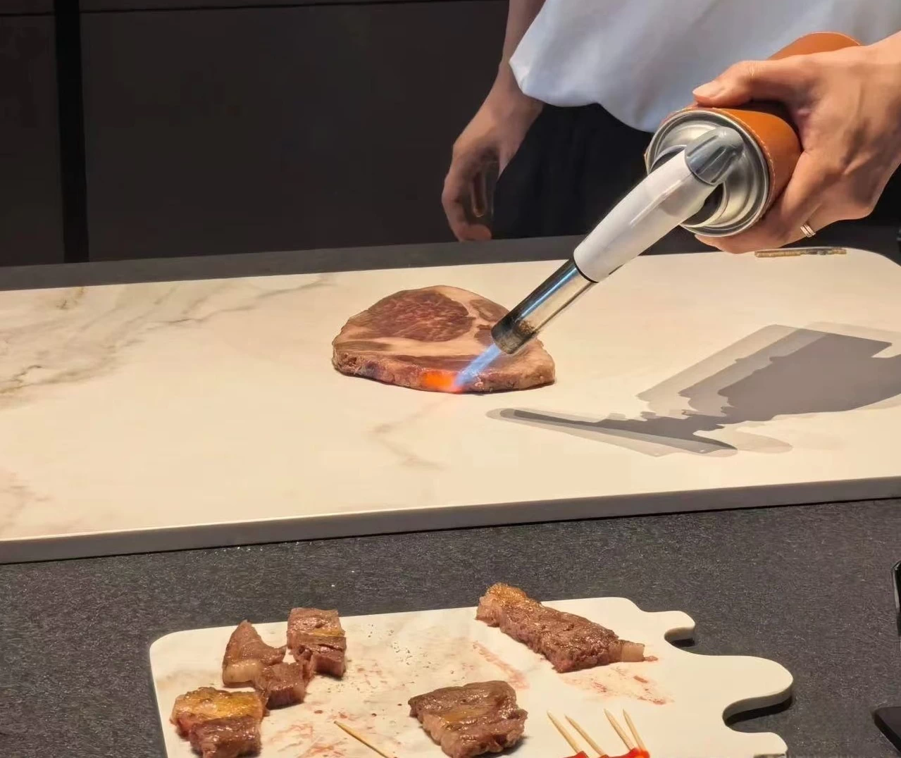 Flame test on sintered stone countertop proving superior heat resistance
