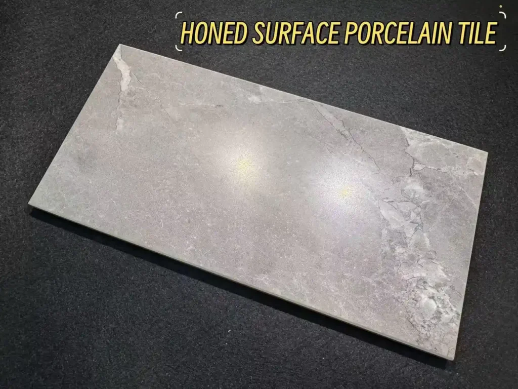 Grey honed surface porcelain tile slab with soft sheen and subtle stone veining for contemporary interiors