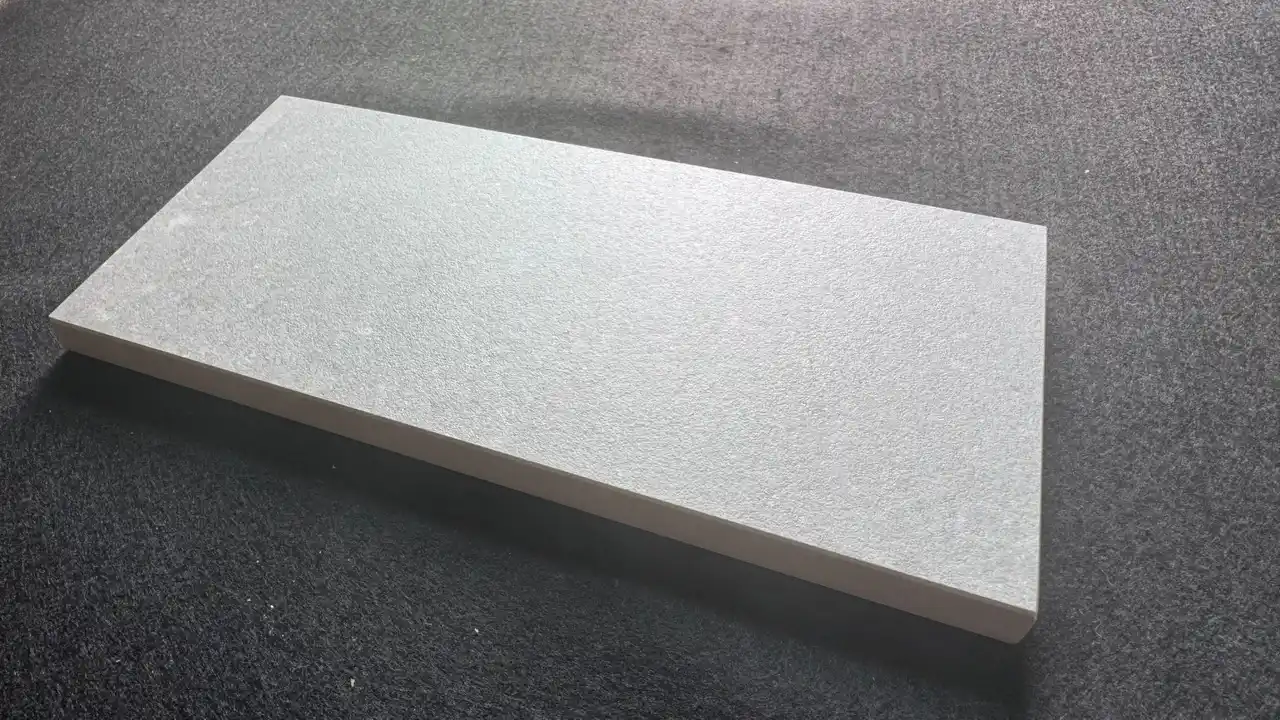 Matt tile finish close-up showing uniform non-reflective tile surface, matte tile surface