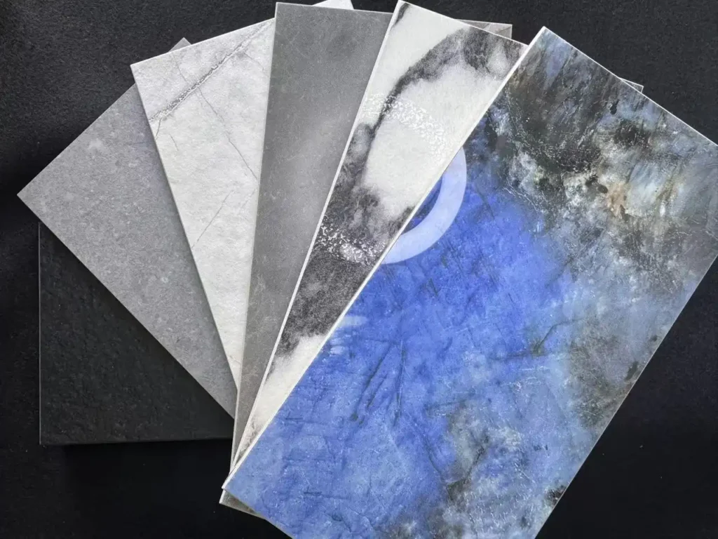 Fan of porcelain samples showing multiple tile finishes and tile surface textures—matte, honed, glossy, lappato, and rock-textured—by Kingsun.