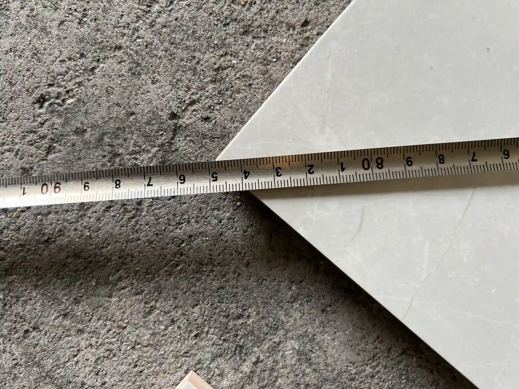 Porcelain Tile Size Tolerance Check by China Supplier Measuring porcelain tile size with a tape
