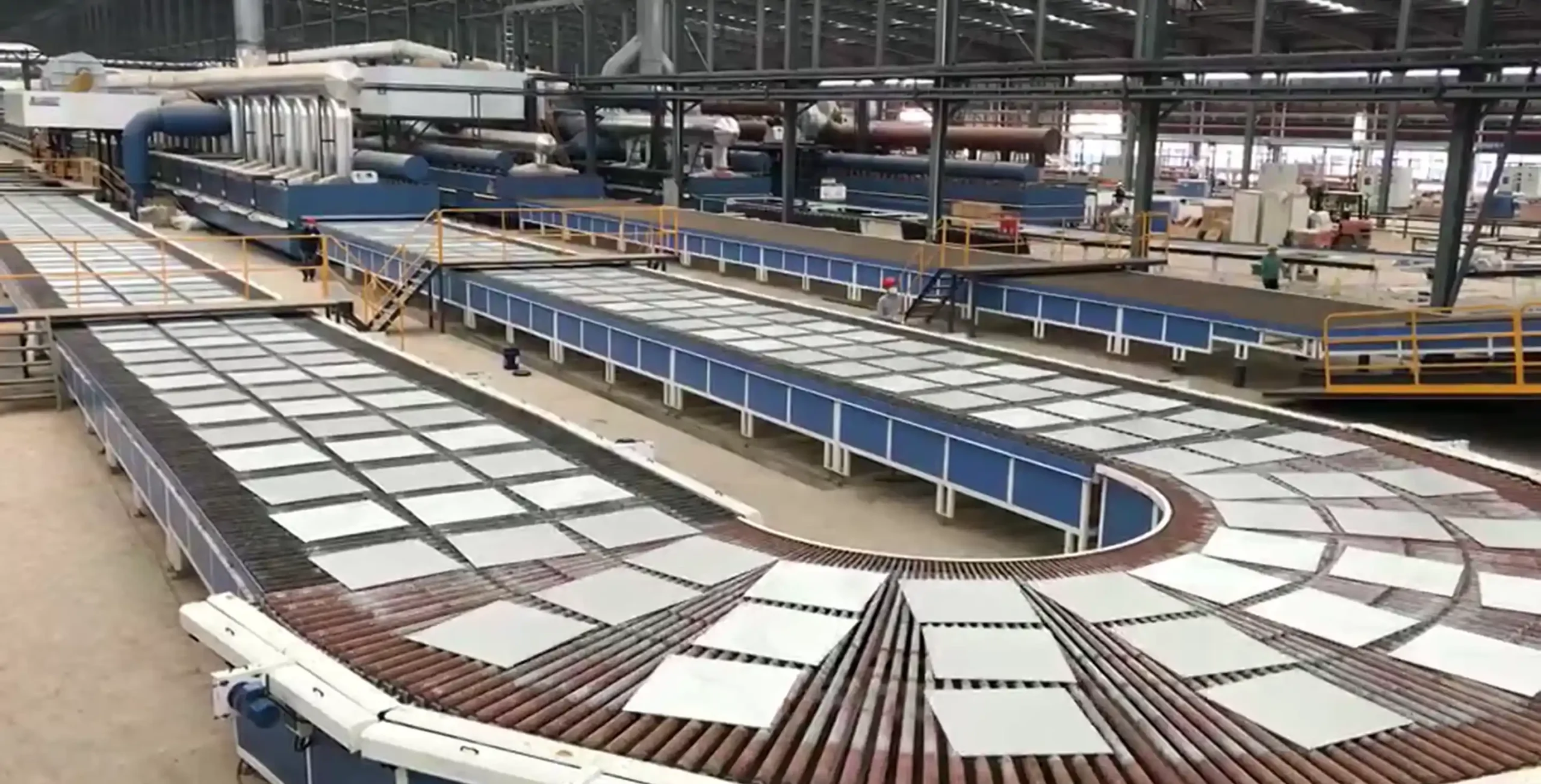 China Ceramic Tile Manufacturer Production Line China ceramic tile manufacturer production line with porcelain floor tiles moving through a large factory conveyor system