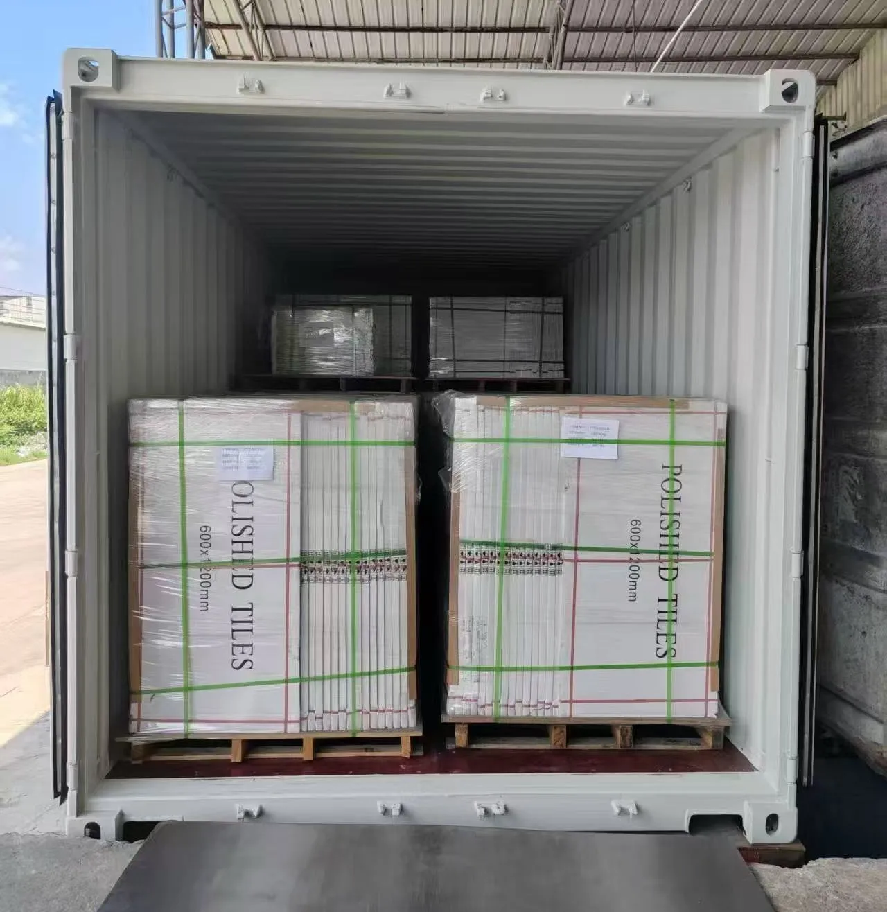 China Tile Exporter Container Loading China tile exporter loading polished tiles into a shipping container for porcelain tile wholesale orders