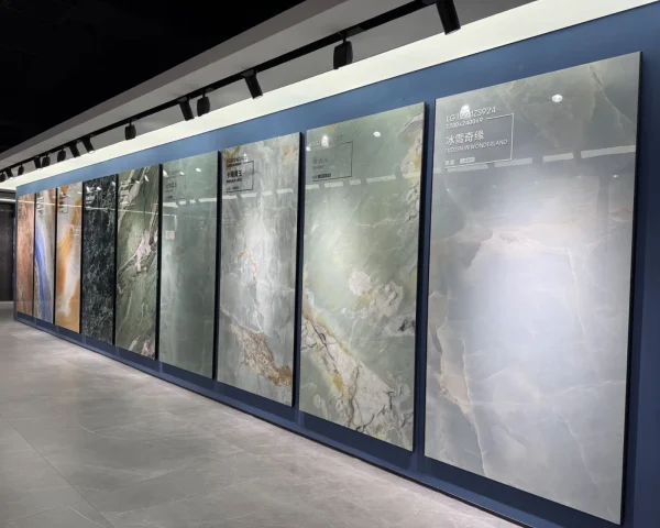 China tile showroom with large marble-look porcelain slabs displayed on a wall in multiple colors and patterns