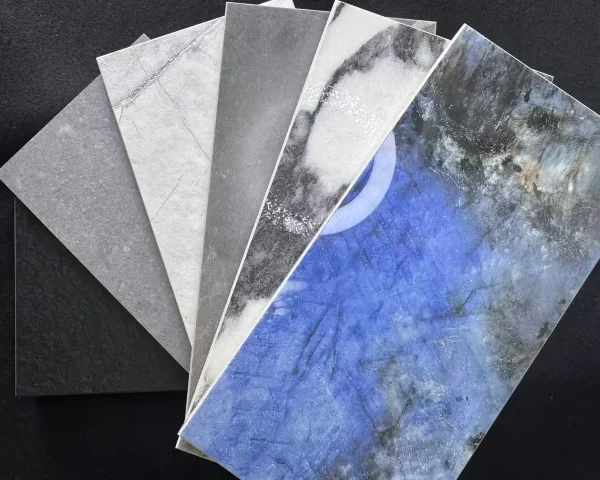 Fan of porcelain samples showing multiple tile finishes and tile surface textures—matte, honed, glossy, lappato, and rock-textured—by Kingsun.