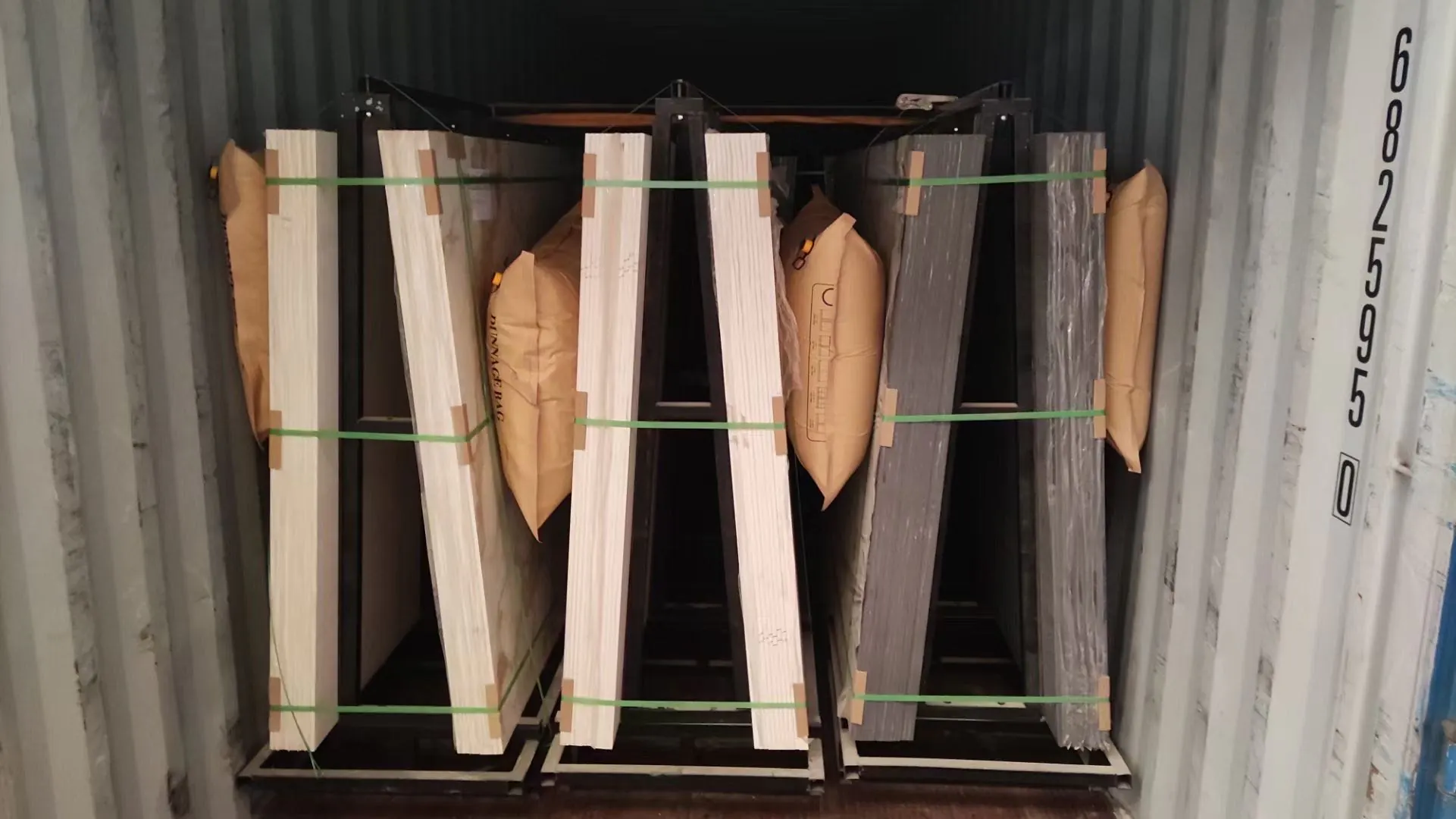 Secure container loading of sintered stone slabs for export, Professional container loading process for sintered stone slabs, ensuring safety during international shipping and maintaining competitive pricing