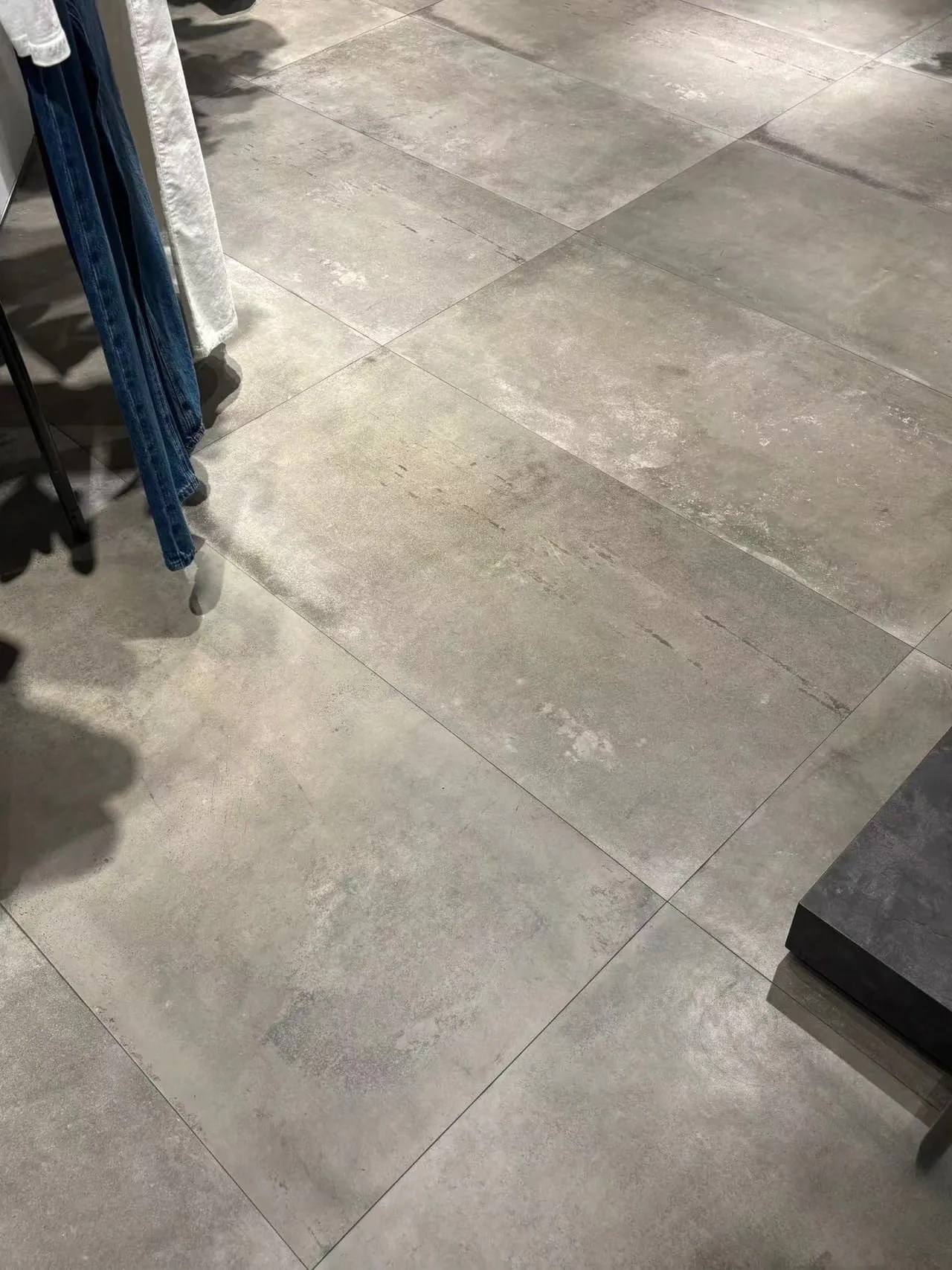 Cement grey concrete effect porcelain floor tiles showroom installation