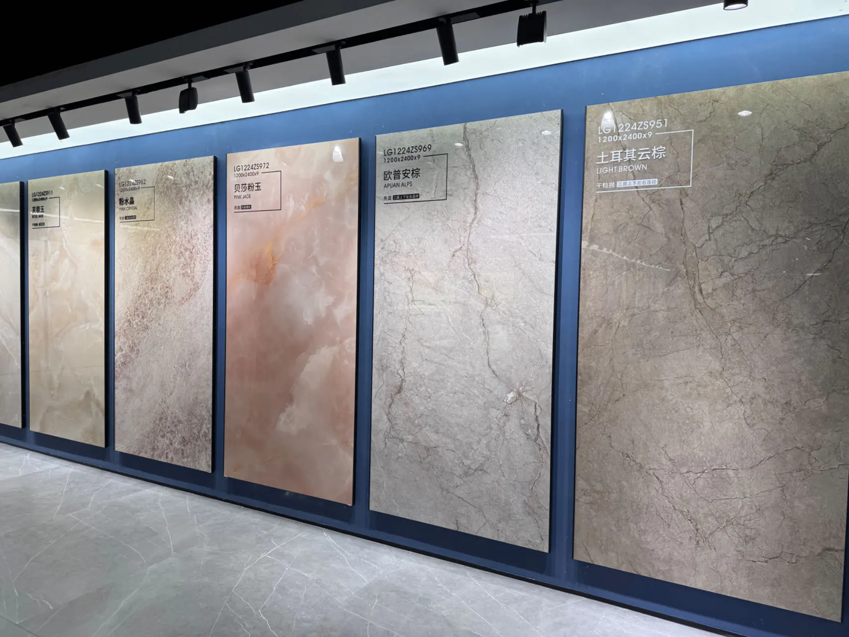 Sintered stone showroom with soft beige and marble effect slabs