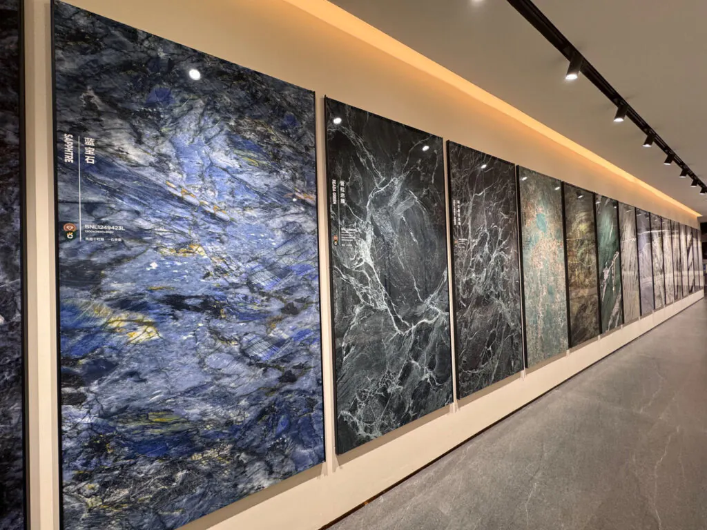 Sintered stone big slab display wall at Kingsun showroom in Foshan, China, marble-look panels for walls and floors.