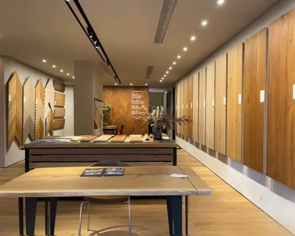 Kingsun China wood tile showroom displaying full-size planks and chevron panels for professional flooring selection.