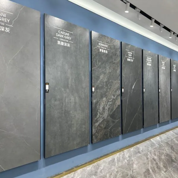 Sintered stone / big slab porcelain tiles on display in Kingsun Foshan showroom — dark grey large‑format panels.